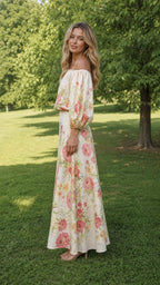 Side profile view of cream floral two-piece set outdoors