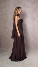 Side profile of model in espresso brown ruched gown