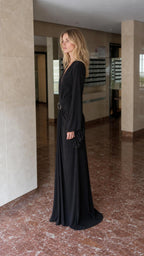 Side profile view of black evening gown