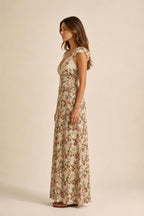 Side profile of beige floral print maxi dress