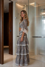 Model wearing beige paisley print two piece set side view