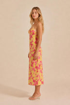 Side view of yellow floral midi slip dress
