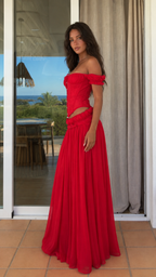 Side view of red corset-style two-piece maxi skirt set