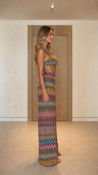 Side view of model wearing multi-color chevron knit two-piece set