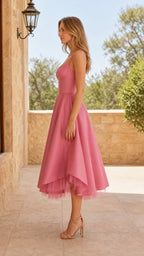 Side profile view of pink midi dress