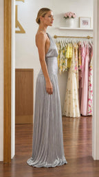 Side profile of silver metallic halter maxi dress