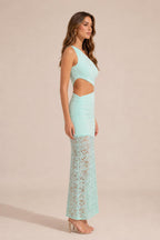 Side profile view of mint one-shoulder cutout dress