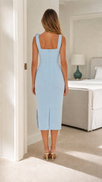 Back view of light blue midi dress showing clean tailoring