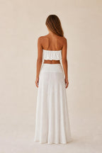 Back view of the white two-piece set showing relaxed wide leg drape