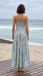 Back view of the cream floral maxi dress with slim shoulder straps
