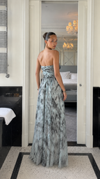 Back view of abstract sage print strapless maxi dress with gathered bodice