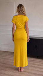 Back view of model in yellow maxi dress