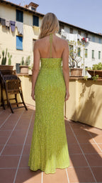Back view of lime green sequin halter dress showing open back