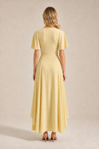 Back view of yellow maxi dress showing sleek fit and back neckline