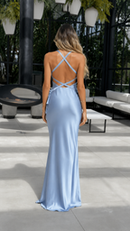 Back view of dusty blue maxi dress with crisscross straps and open back