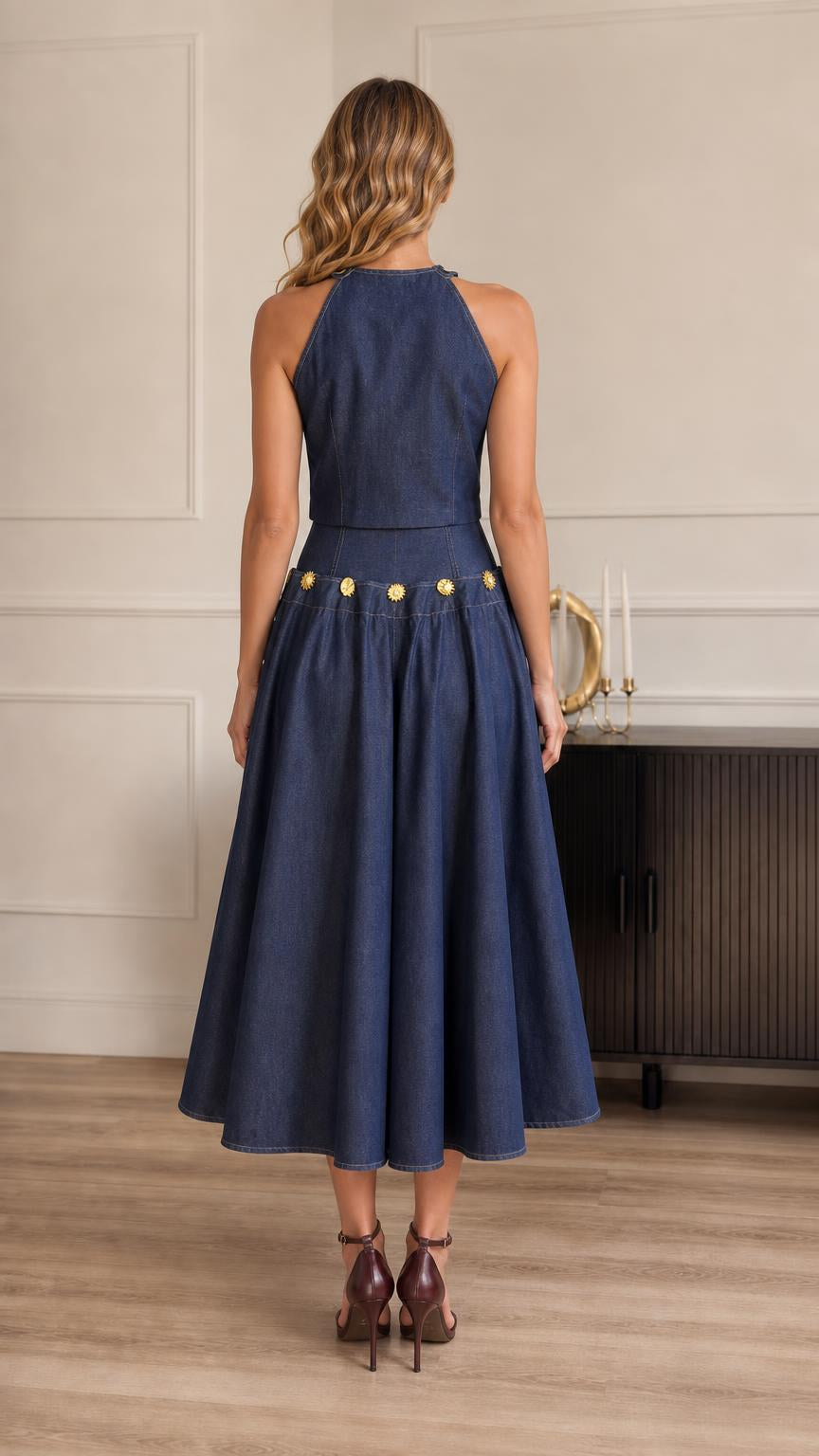 Back view of model showcasing blue denim midi skirt and halter back