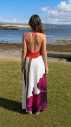 Back view of red floral halter maxi dress showing open back