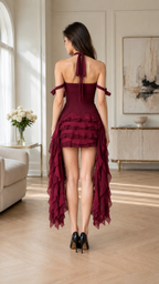 Back view of burgundy cross halter dress with cascading high-low hem