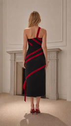 Back view of black midi dress with asymmetric strap