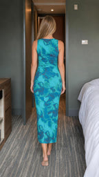 Back view of teal abstract print midi dress