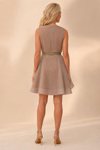 Back view of model wearing taupe organza dress