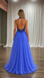 Back view showcasing open back design of blue gown