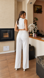 Back view of white two-piece wide leg pants set with sleeveless cropped top