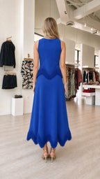 Back view of model in royal blue fringe midi dress