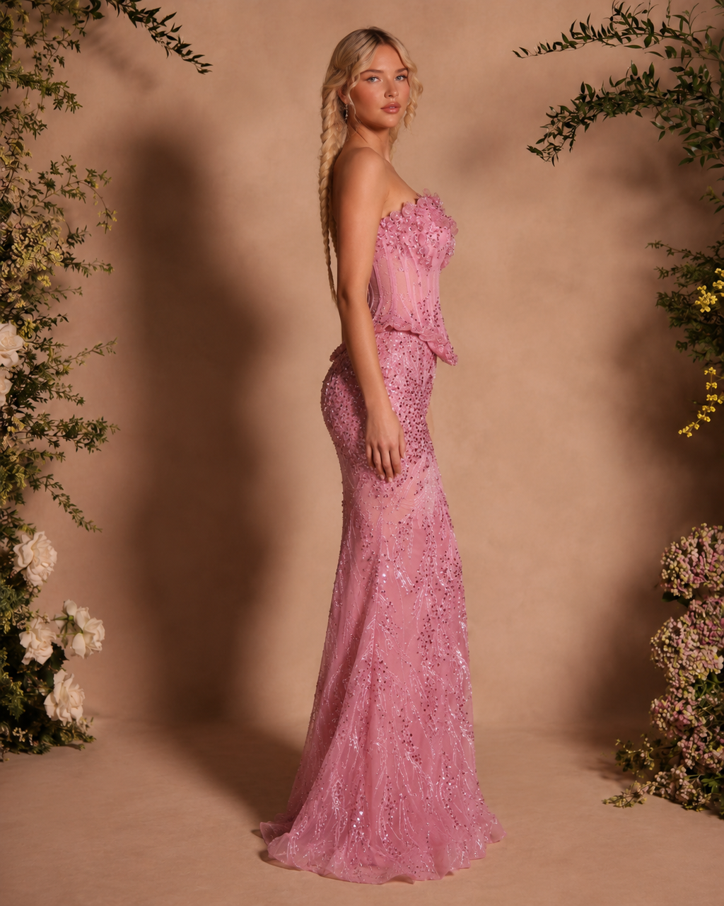 Side view of blush pink strapless embellished mermaid evening gown