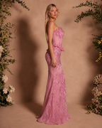 Side view of blush pink strapless embellished mermaid evening gown