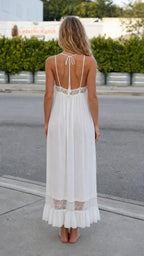 Back view showing tie straps on white maxi slip dress