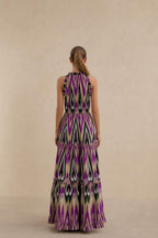 Back view of model in purple multi ikat print maxi dress