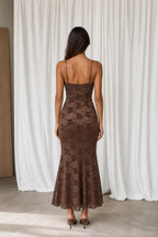 Back view of model showing slim straps and mermaid silhouette
