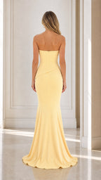 Back view of yellow strapless mermaid dress with train