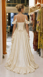 Back view of Champagne gown featuring lace-up corset detail and train