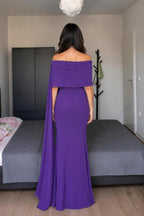 Model wearing purple off-shoulder cape maxi dress back view
