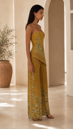 Side view of mustard embroidered sleeveless top and matching pants
