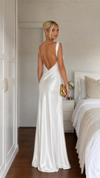 Back view of ivory backless satin-look maxi dress with low draped back