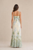 Back view of model wearing ivory floral maxi dress