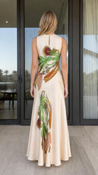 Model wearing cream floral print maxi dress, back view