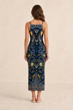 Back view of model in Navy printed midi dress