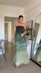 Sage green strapless evening dress with sheer shawl and flowing A-line skirt