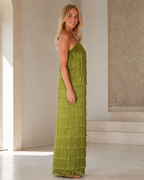 Side view of olive green fringe tiered maxi dress showing long straight silhouette