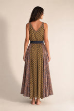 Back view of woman showcasing the fit of the mustard maxi dress
