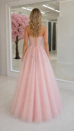 Back view of pink gown with lace-up corset detail