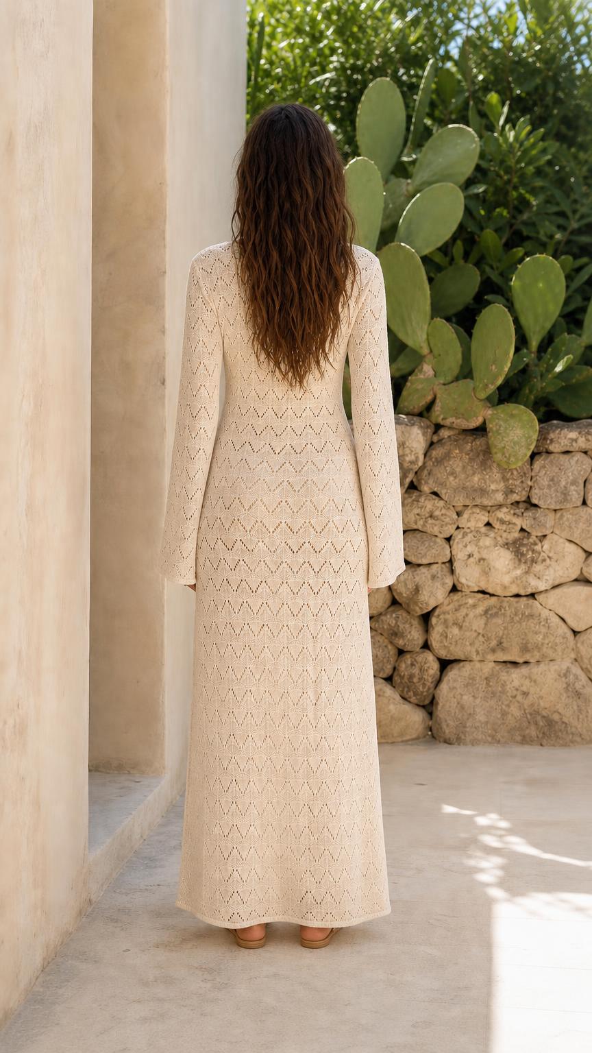 Back view of woman in beige knit maxi dress