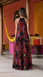 Back view of black mosaic print halter maxi dress