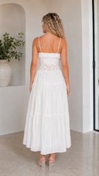 Back view of white sleeveless maxi dress with straight neckline and lace-look waist