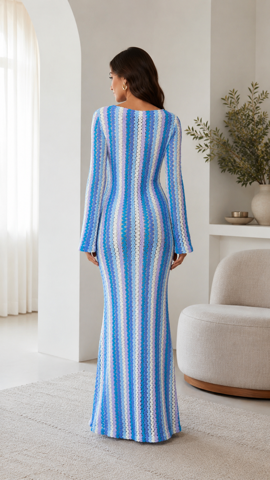 Back view of blue long sleeve striped maxi dress with slim fit silhouette
