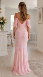 Back view of blush pink cold shoulder ruffle floral maxi dress with low V back
